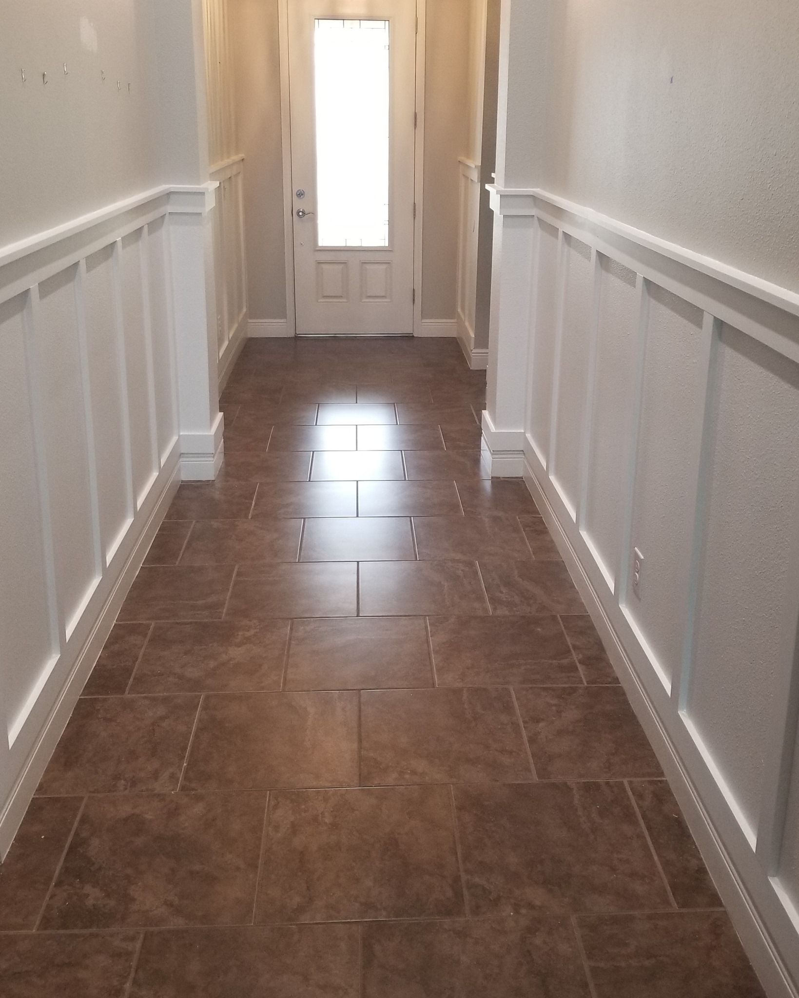 Hallway with Wainscoting by Crafted Palm